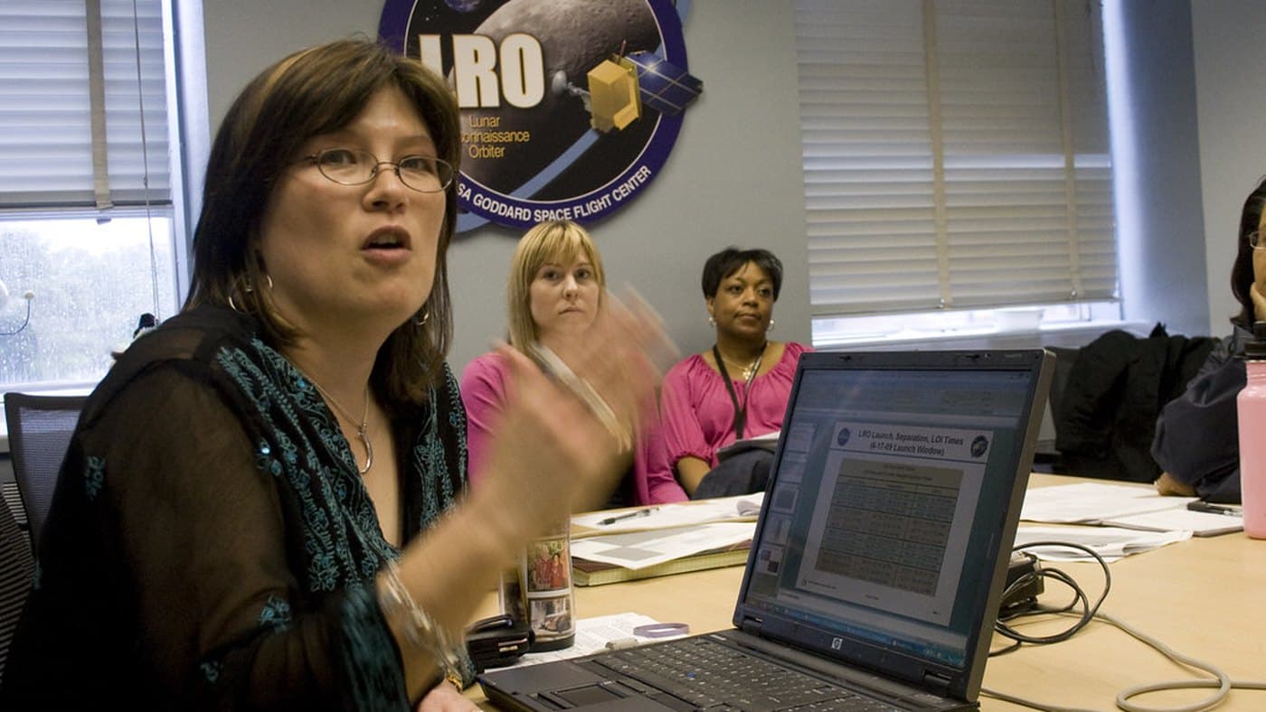 RevOps analyst reviewing CRM field noise, source records, and operating fields at a laptop