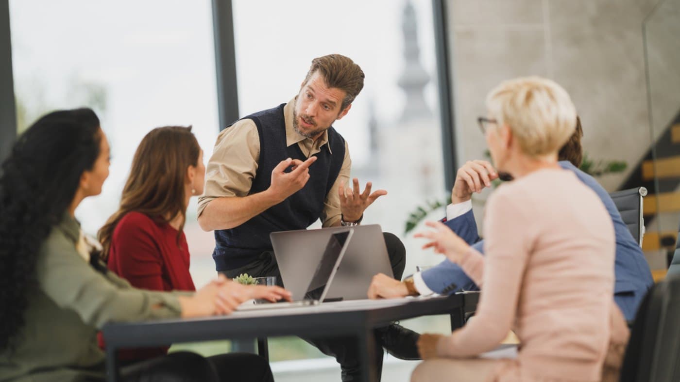 Account team discussing relationship coverage, customer health context, and renewal follow-up in a meeting