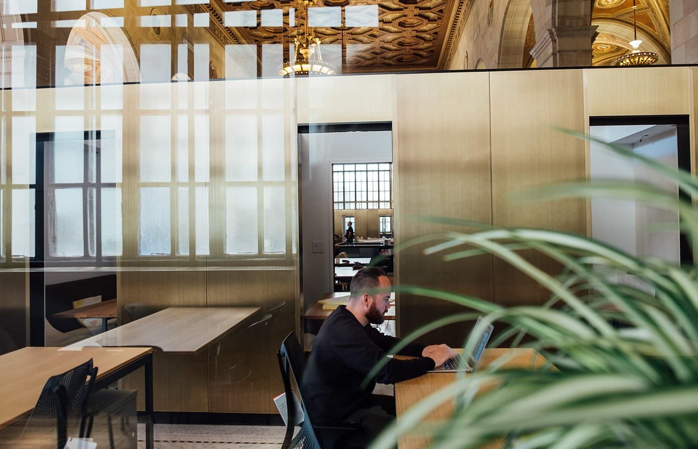 Modern office workspace where revenue operations teams review account activity and follow-up evidence
